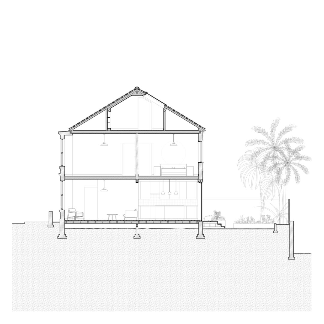 A black-and-white architectural cross-section of a two-story house with visible interior details like furniture and lighting. The house is elevated above ground, and there is a palm tree in the garden.