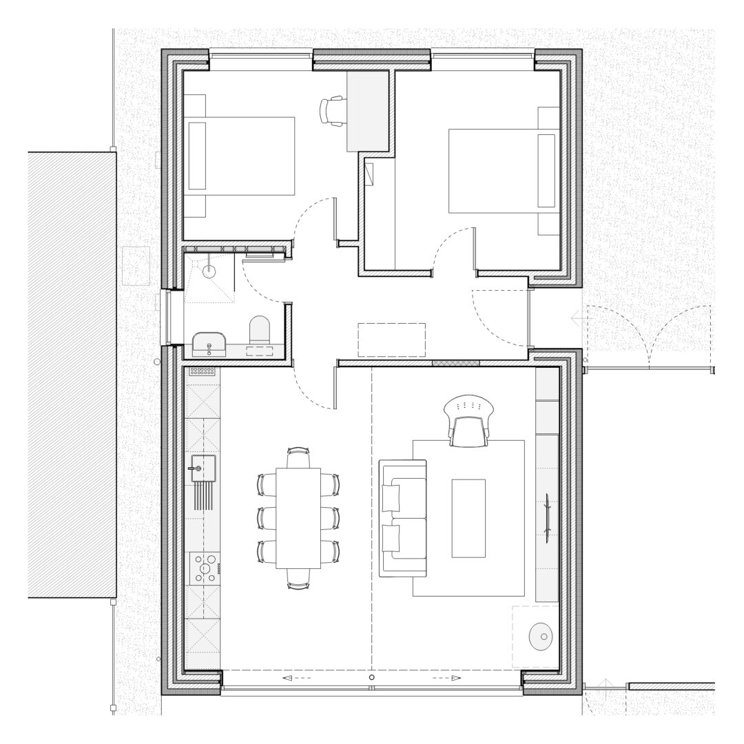 Black and white floor plan of a house with two bedrooms, a bathroom, a kitchen with an adjacent dining area, and a living room. The layout shows furniture placement, including beds, a dining table, sofas, and a TV.
